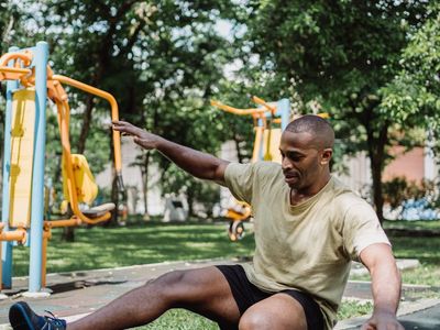 A man performing a bodyweight squat with perfect form and balance.